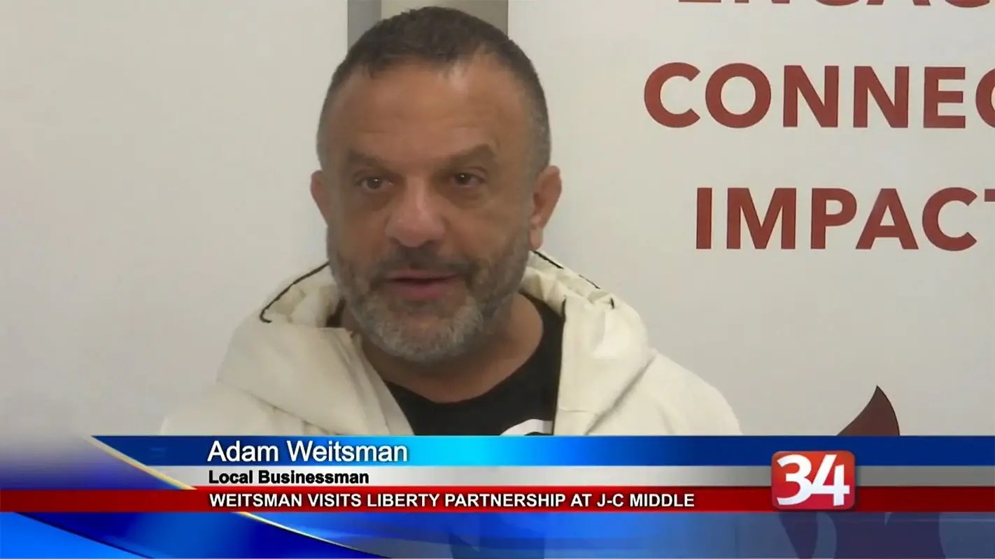 Screenshot of Adam Weitsman being featured on the news